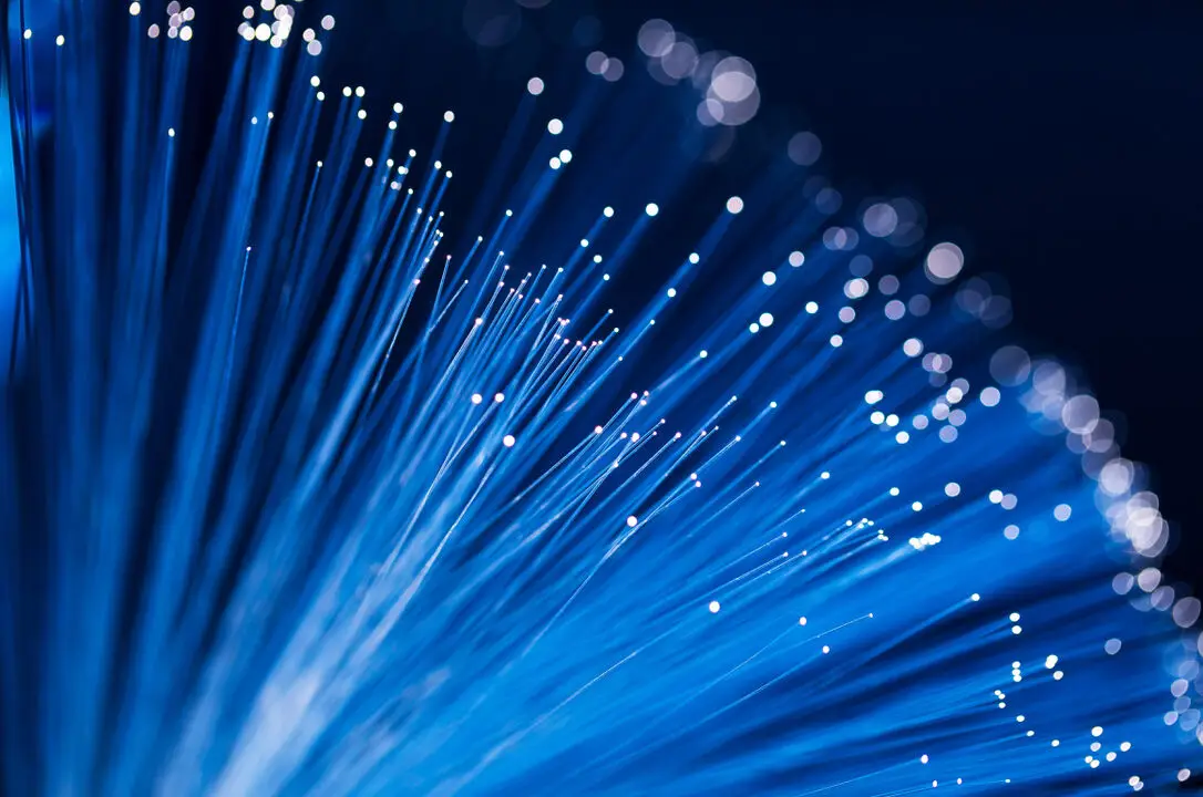 Fiber optical network cables glowing with light