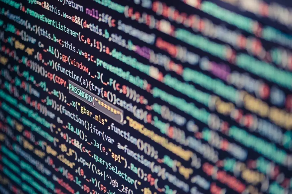 Close-up of source code on a dark screen, illustrating Claude Opus 5.5 and Sonnet 5.5 coding workflows